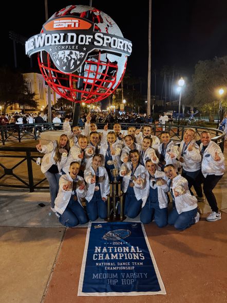 Foothill Varsity Dance team smiling with at the National Dance Team Championship in Orlando, Florida.
