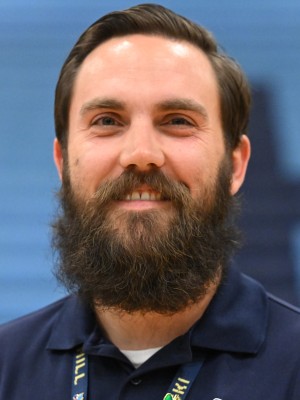 Joseph Kielminski, a teacher at Foothill High School smiling for award.