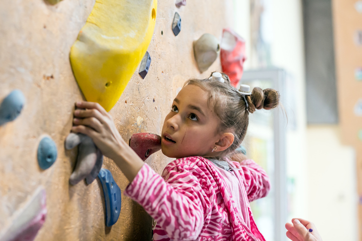 Girl Child Climbing Indoor Rock Wall